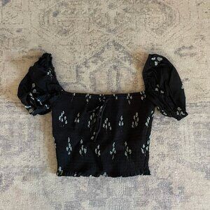 Aritzia Wilfred black smocked blouse with blue flowers